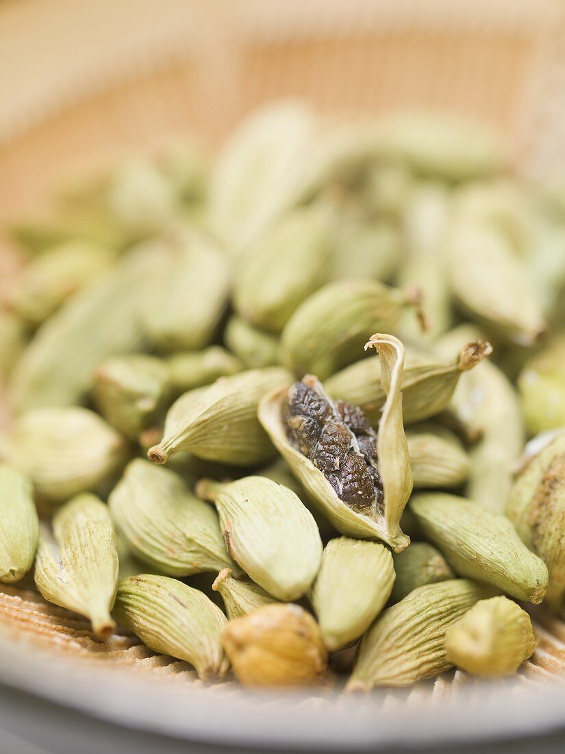 Cardamom pods in a dish