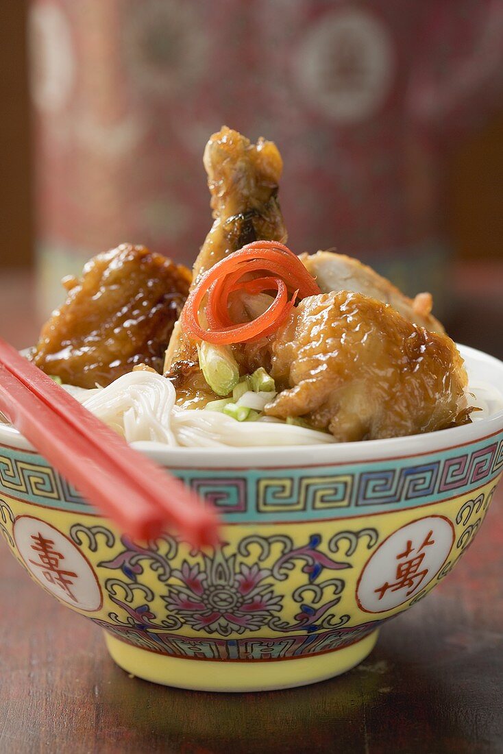 Chicken leg on rice noodles (Asia)