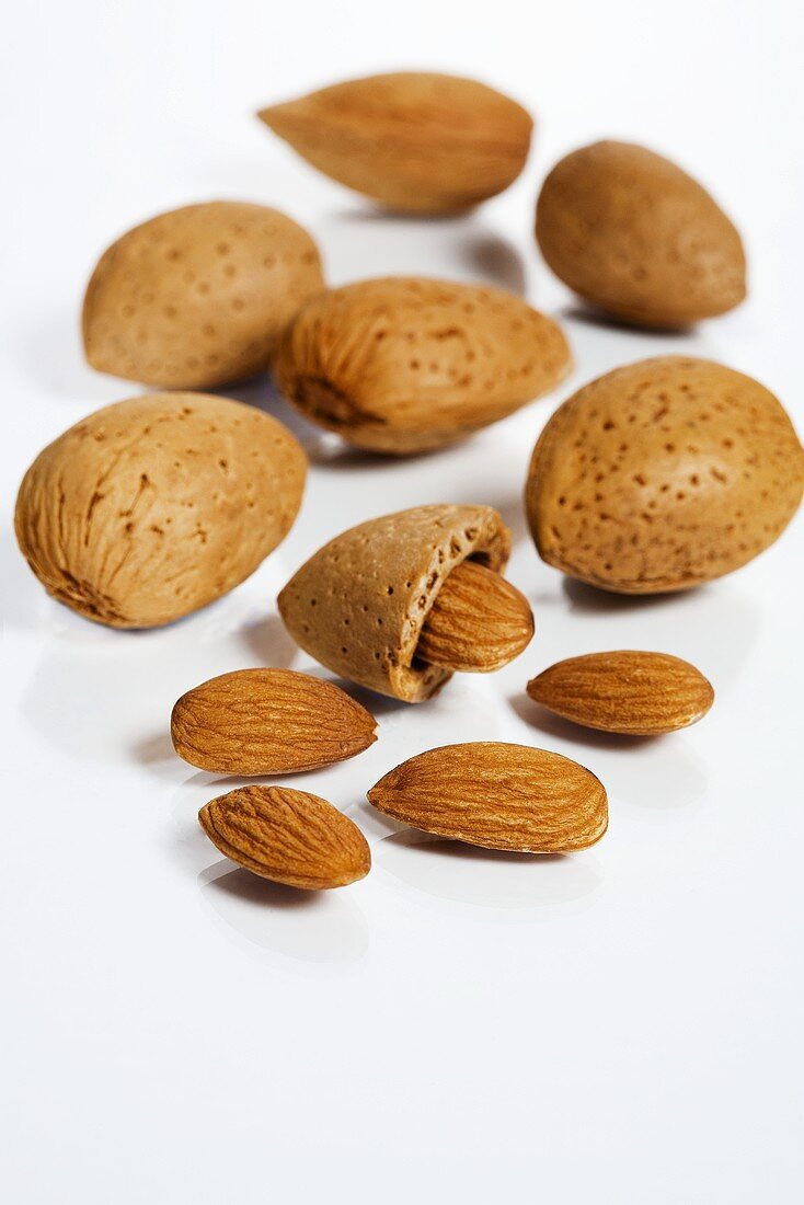 Several almonds, shelled and unshelled