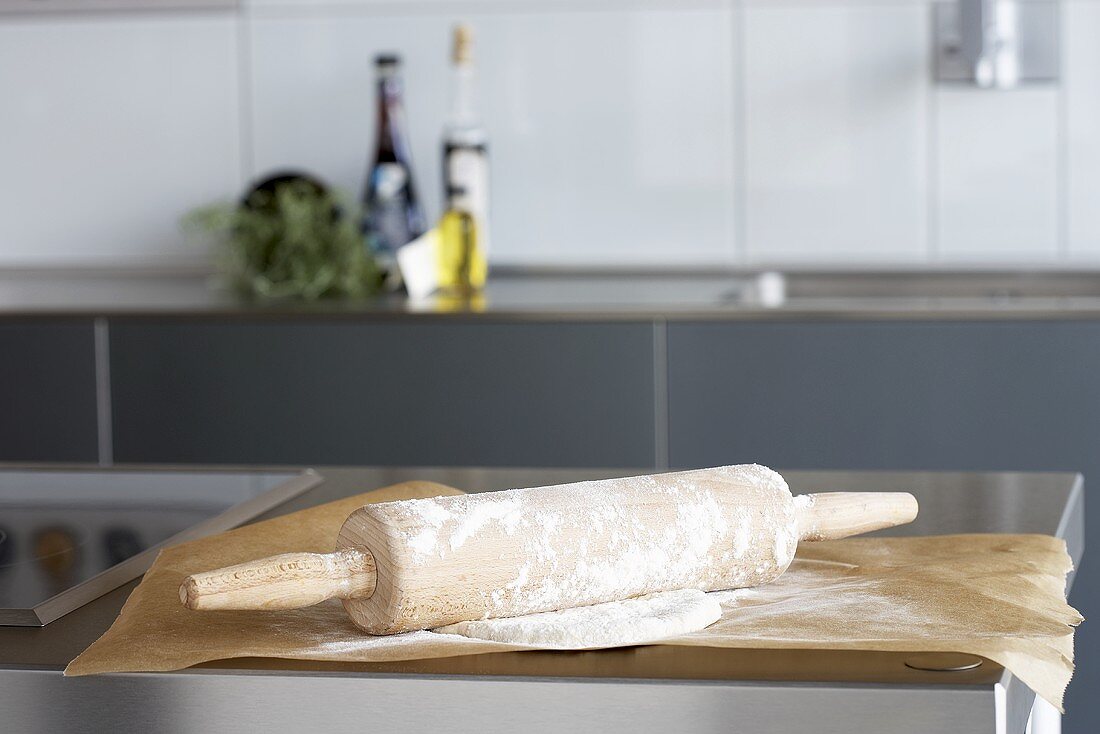 Pastry with rolling pin in a kitchen
