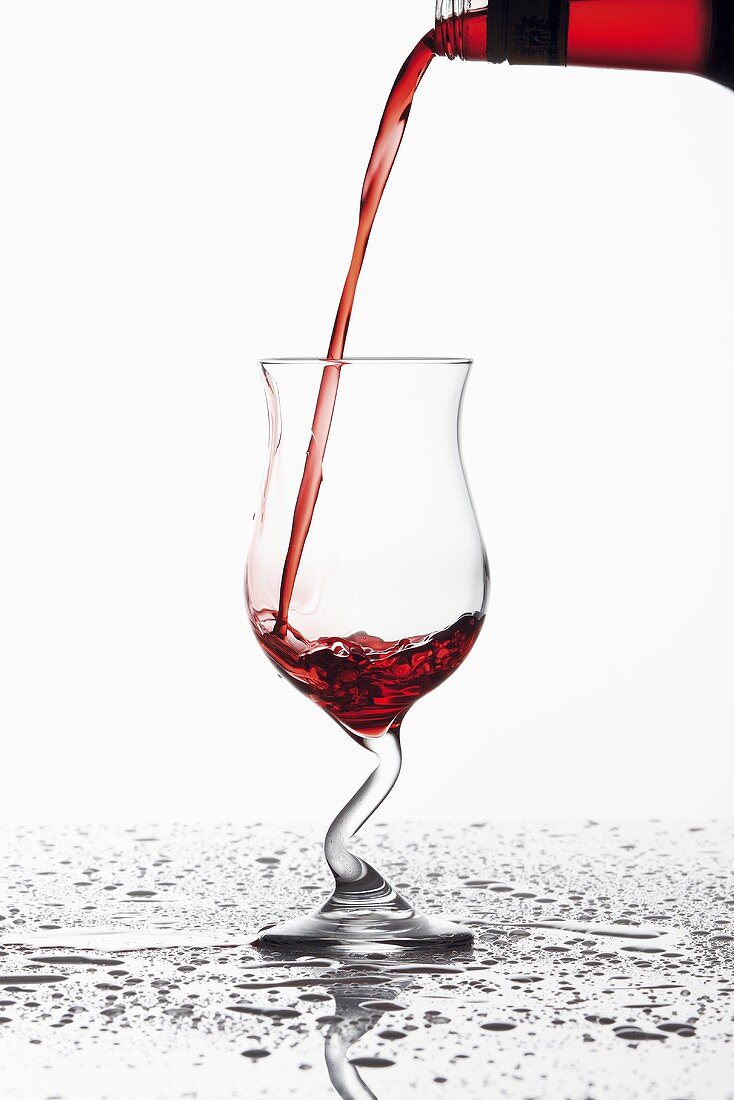 Pouring Campari into a glass