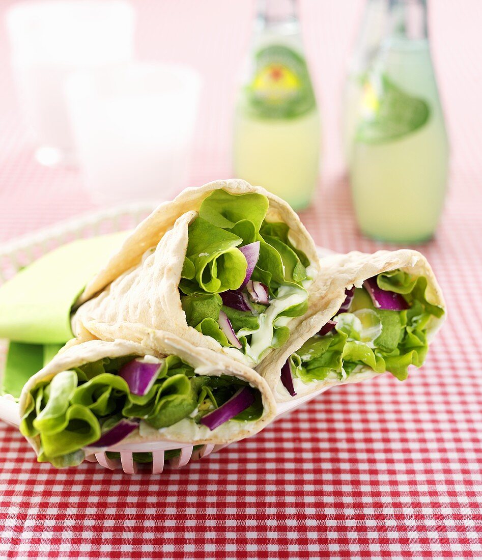 Wraps filled with avocado, red onions, lettuce & wasabi cream