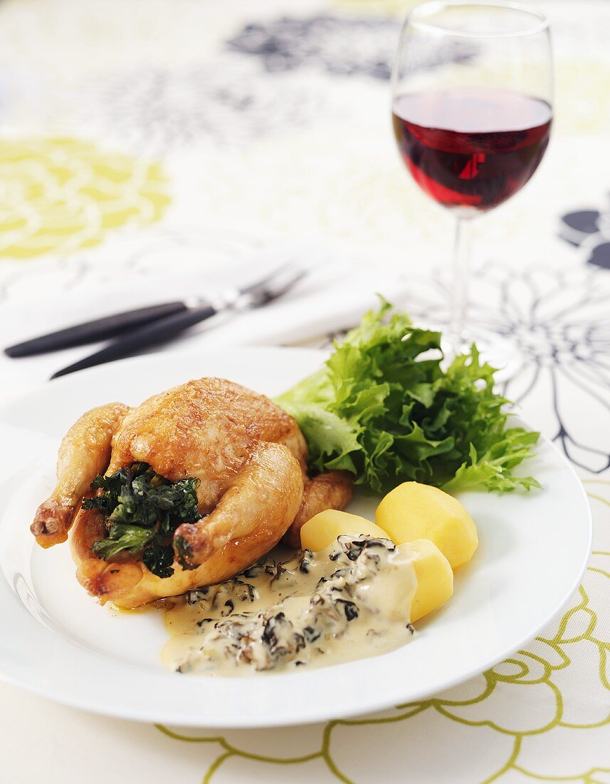 Roast chicken with boiled potatoes and morel sauce