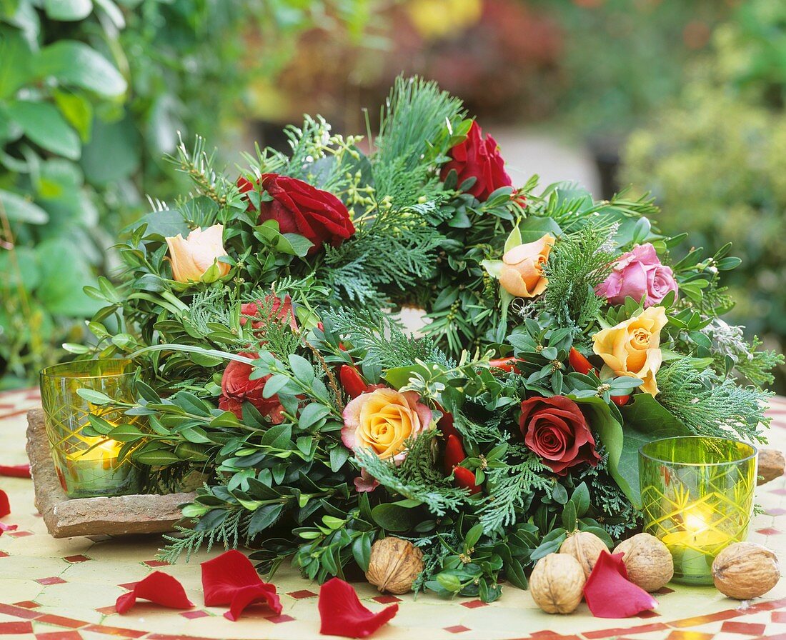 Wreath of box, Thuja and pine with roses