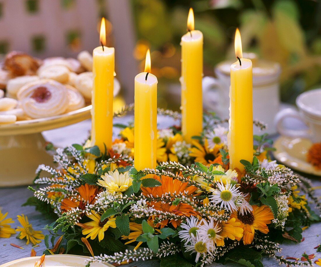 Table wreath with autumn flowers and candles
