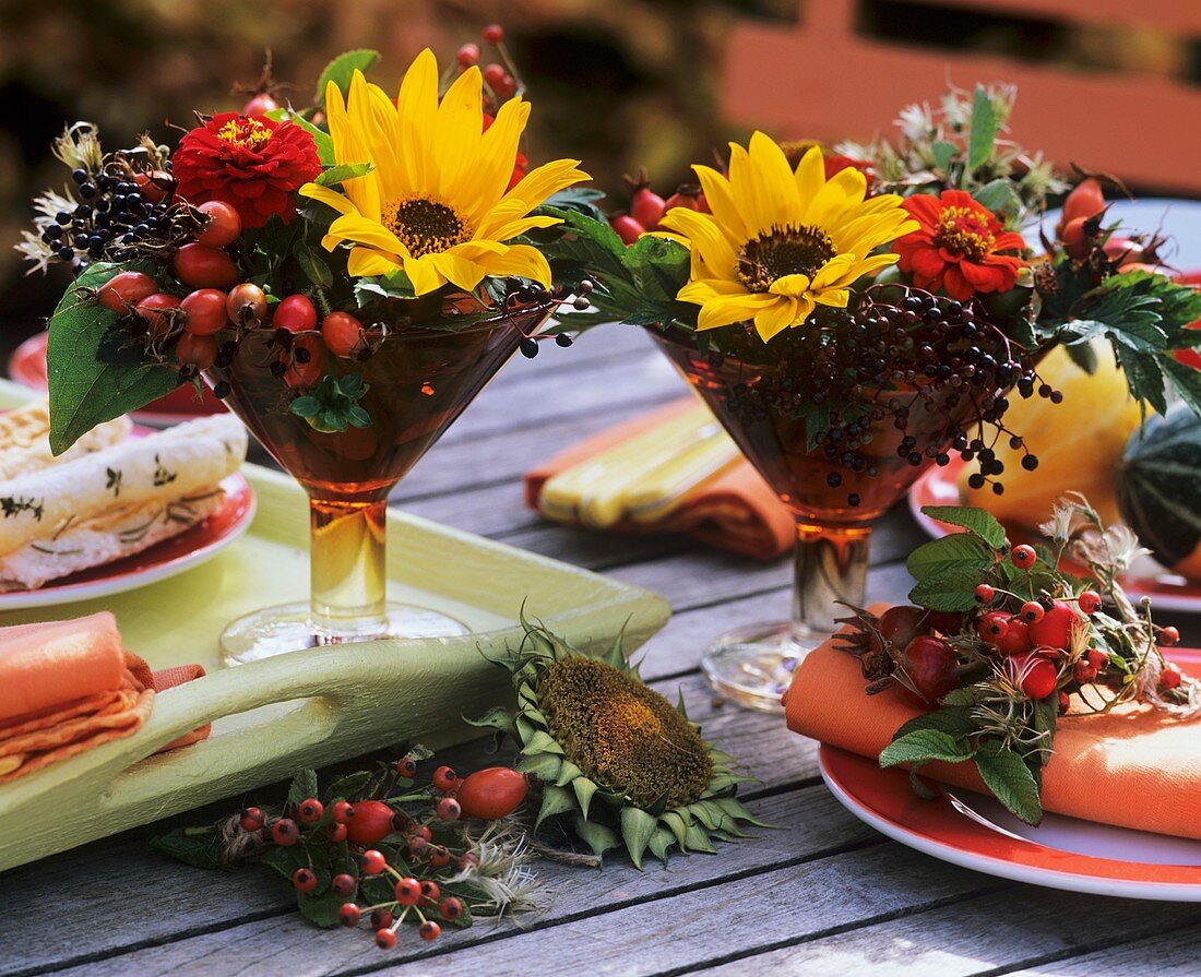 Small arrangements of sunflowers, rose hips & elderberries