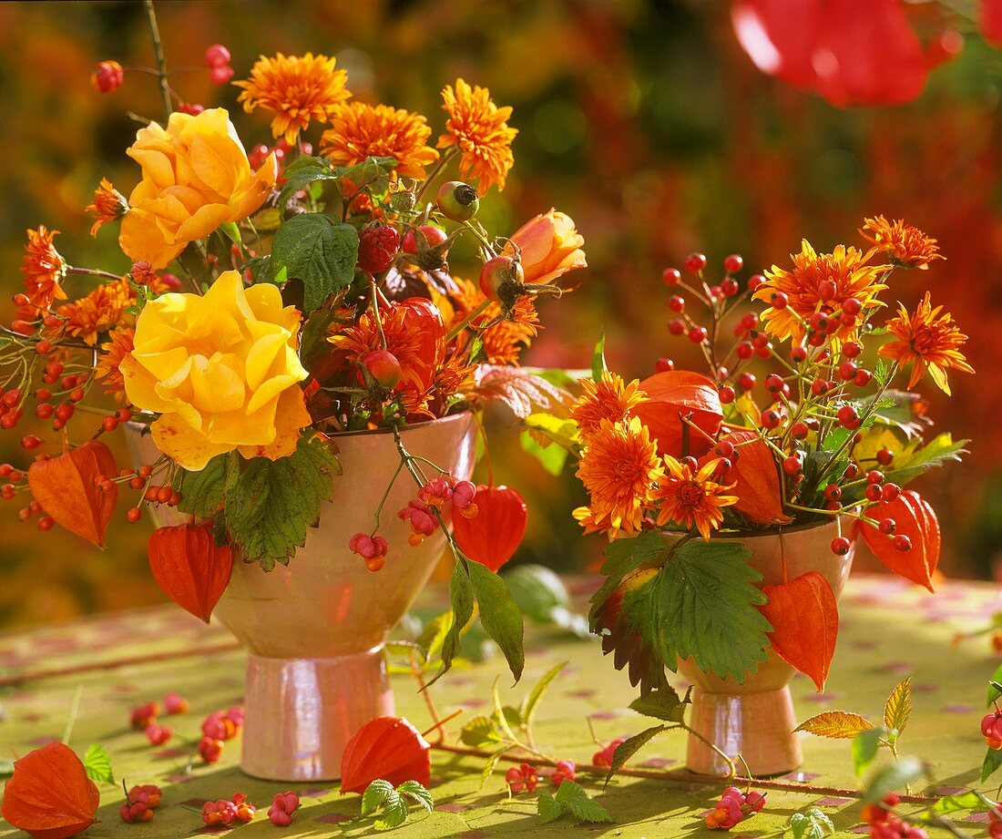 Autumn arrangement of roses, rose hips, chrysanthemums