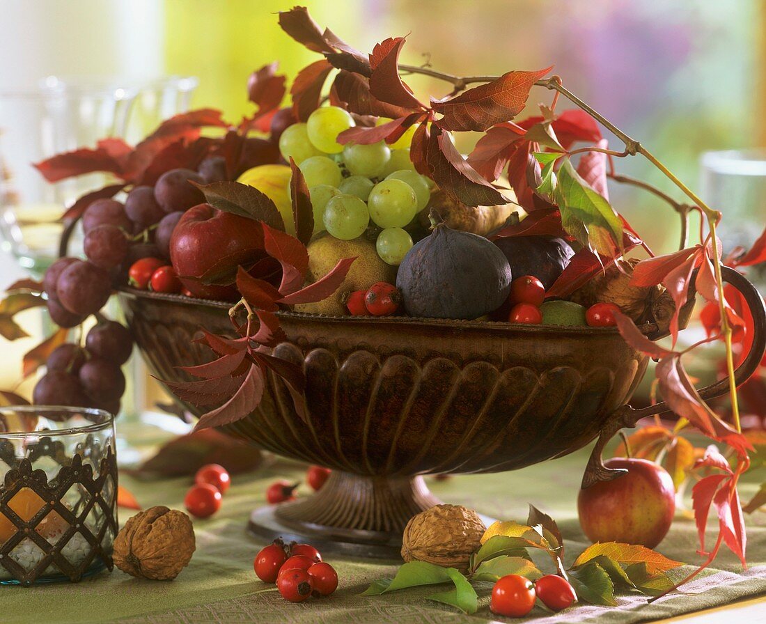 Autumn fruit bowl with figs, grapes and nuts