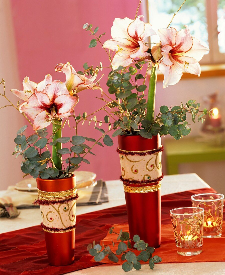 Amaryllis, Eucalyptus and gilded birch twigs in vases