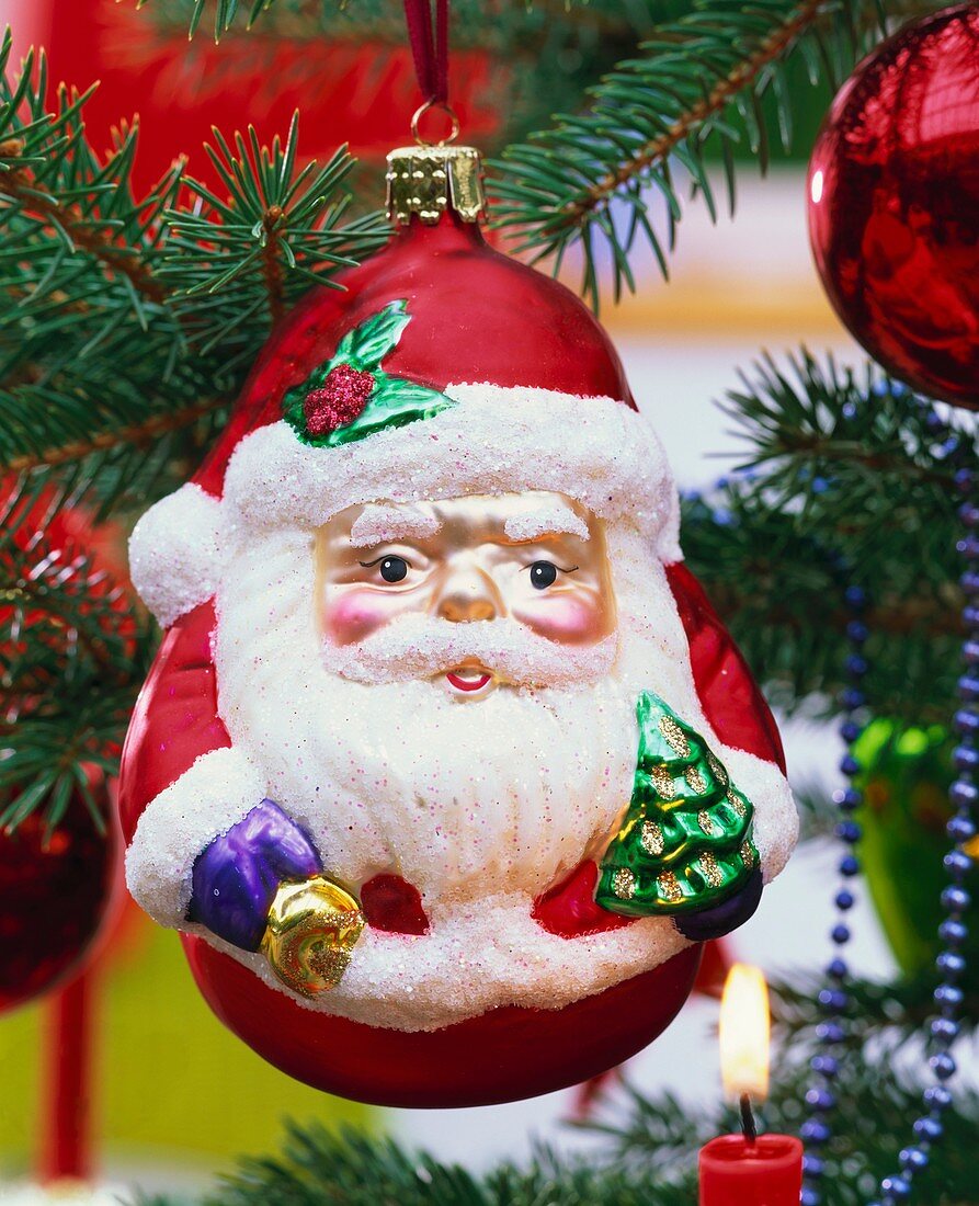 Father Christmas hanging on Christmas tree