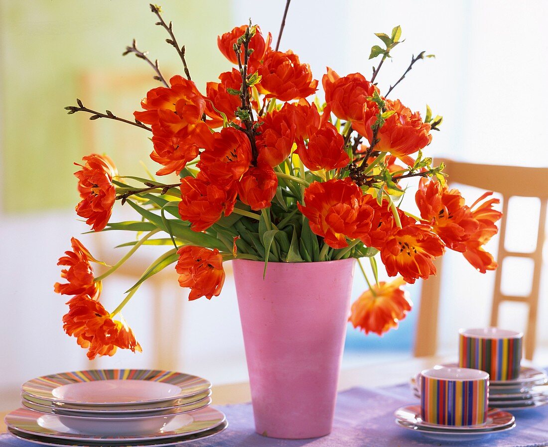 Arrangement of tulips with cherry branches