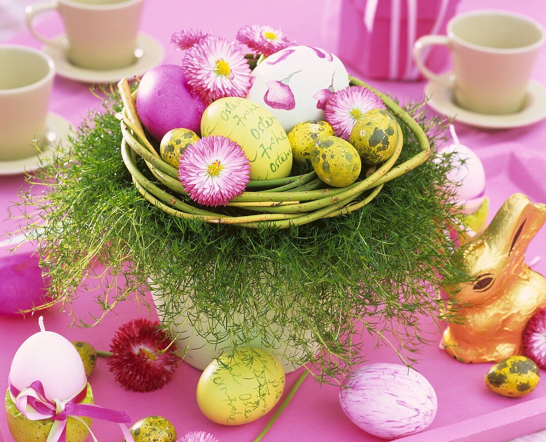 Easter nest of daisies, ornamental asparagus & Easter eggs