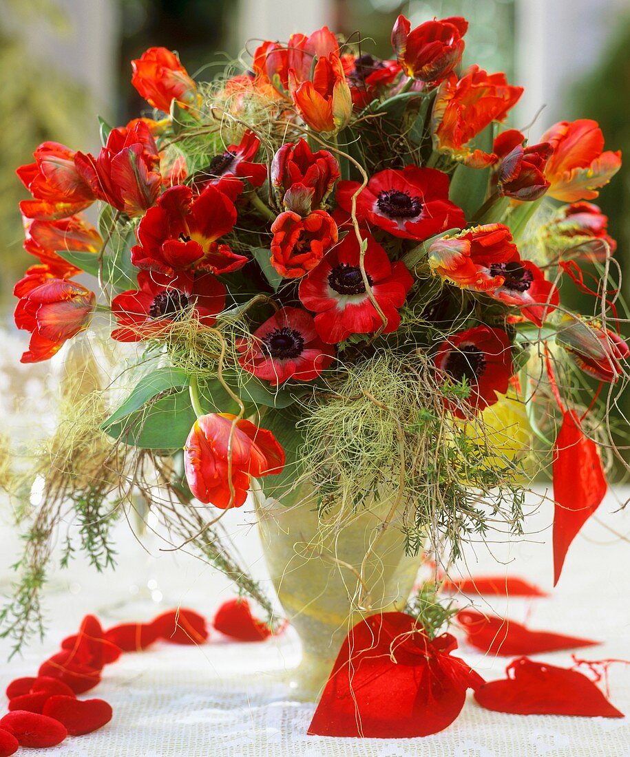 Vase of tulips and poppy anemones, with hearts