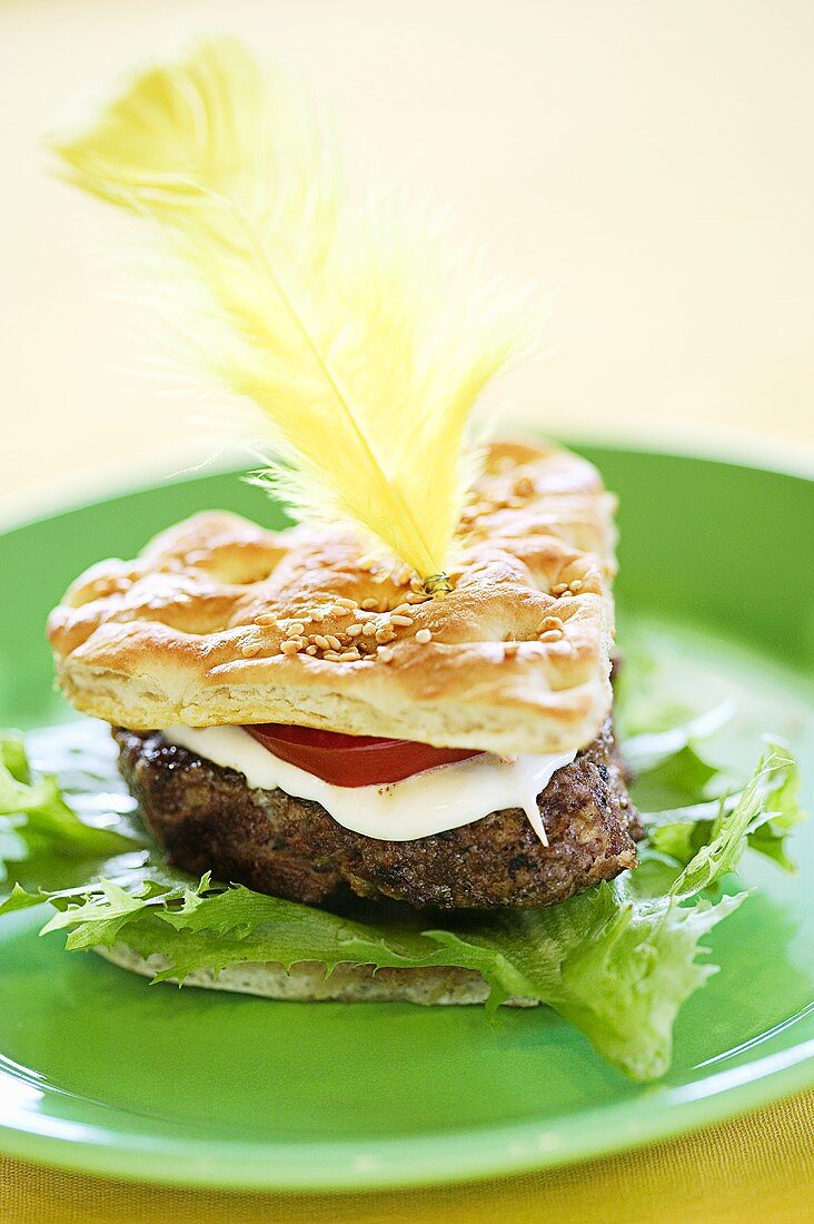 Heart-shaped hamburger decorated with feather