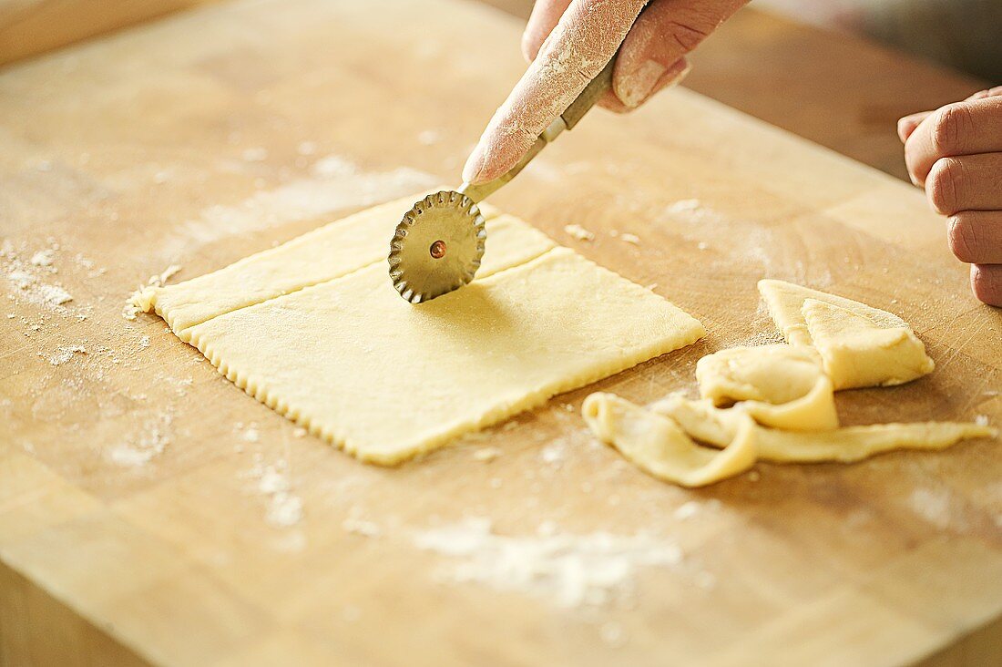 Cutting yeast dough with a pastry wheel