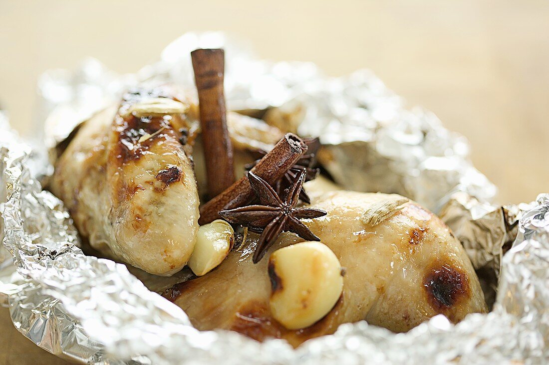 Guinea-fowl with cinnamon sticks, star anise & garlic in foil