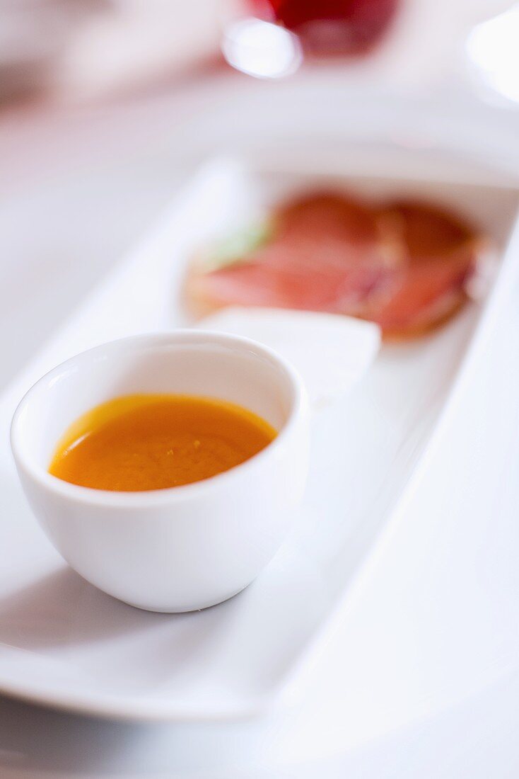 Appetiser plate with soup, cheese and ham