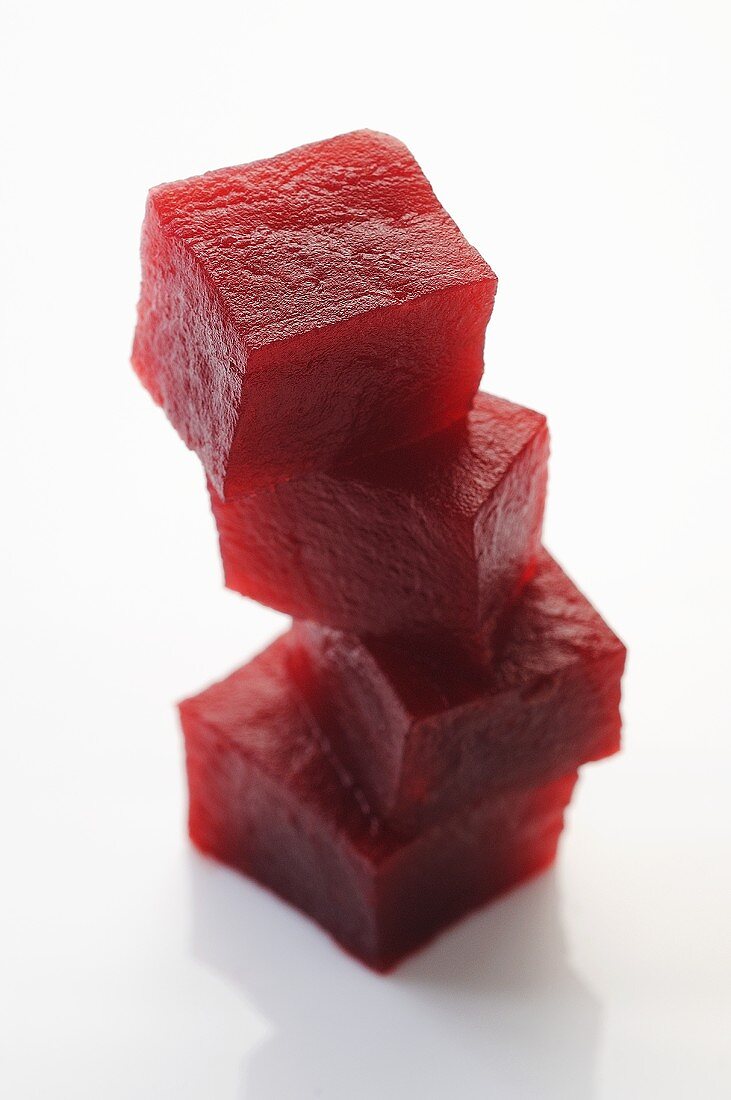 Four cubes of beetroot, stacked