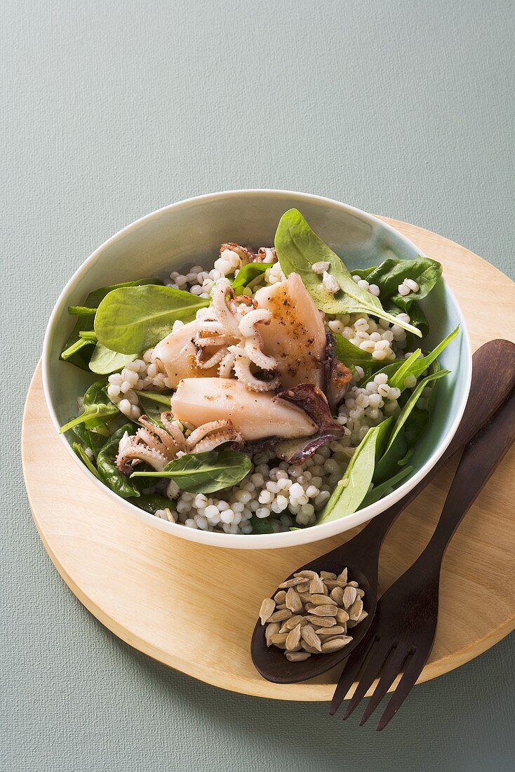 Pearl barley and spinach salad with calamaretti (baby squid)