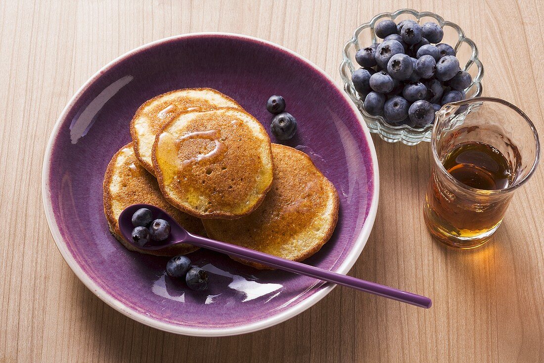 Buckwheat pancakes with blueberries and maple syrup