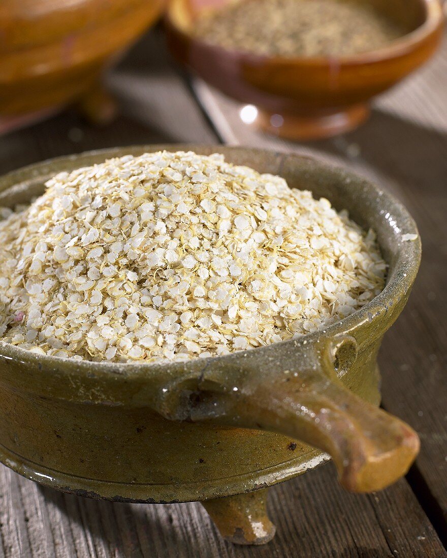Quinoa flakes in terracotta pot