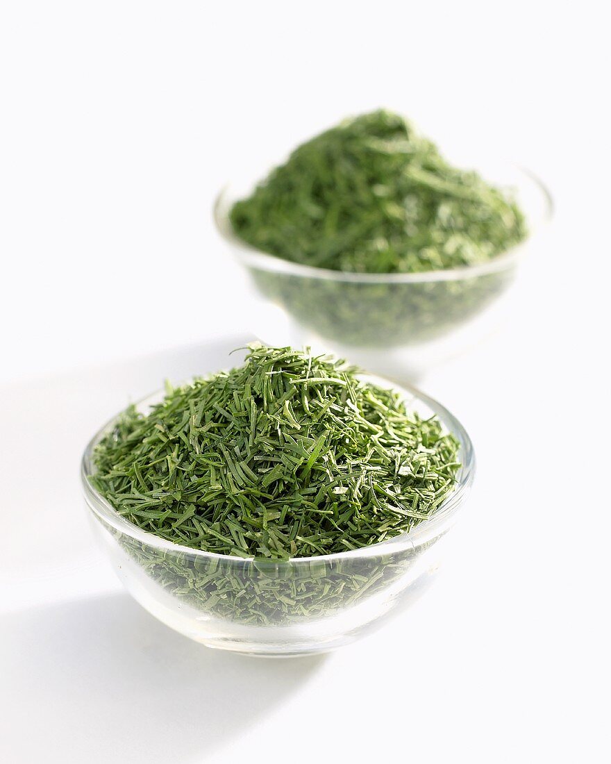Dried dill in glass dishes