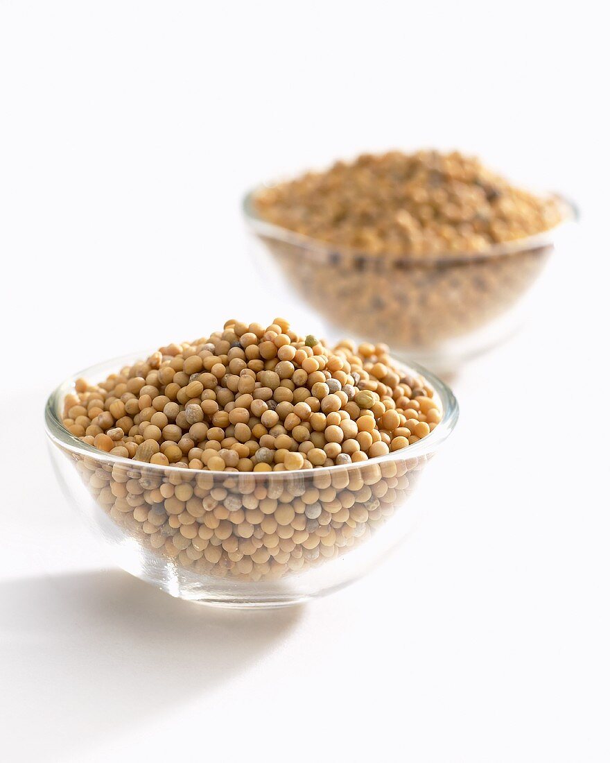 Mustard seeds in glass dishes