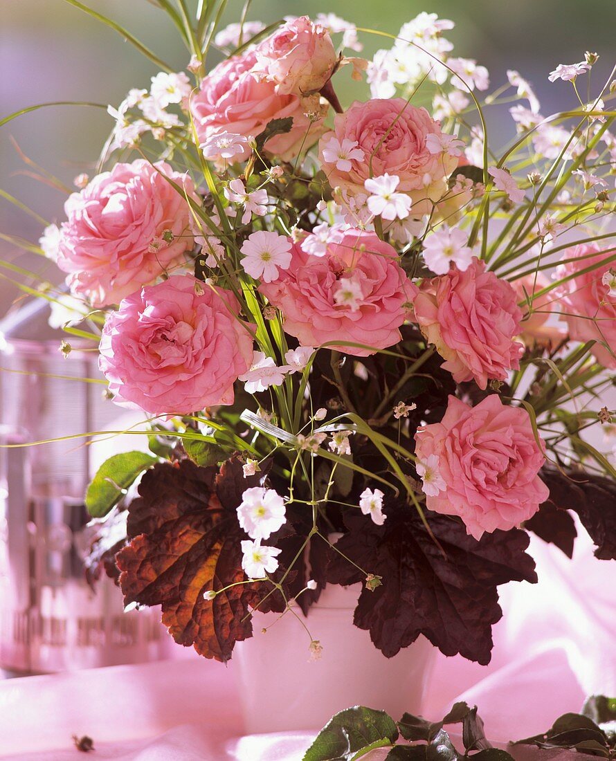 Arrangement of roses, Gypsophila and Heuchera leaves