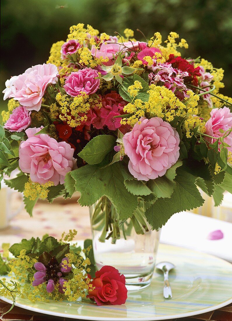 Summer arrangement of roses, lady's mantle & dianthus