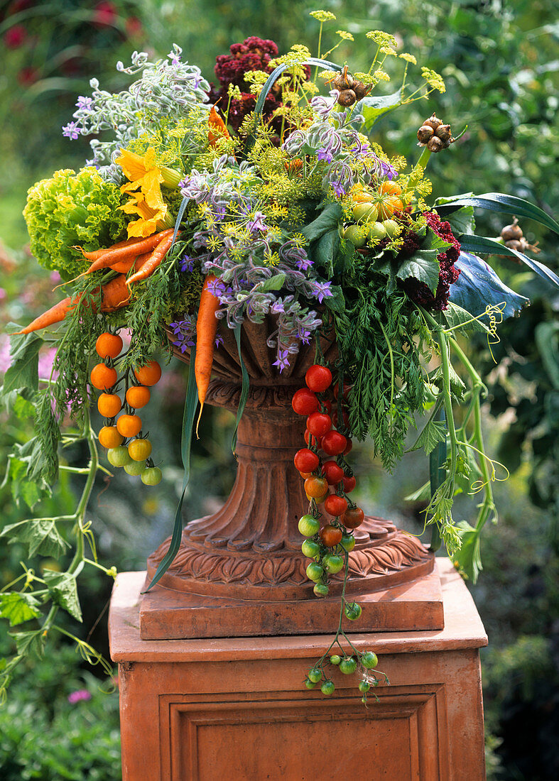 Colourful arrangement of vegetables in terracotta vase