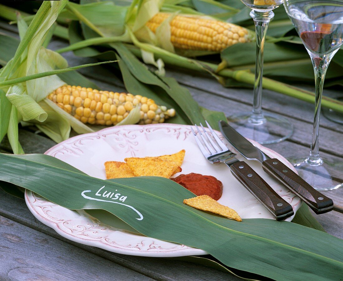 Place setting: maize leaf as place-card, taco chips & chili dip