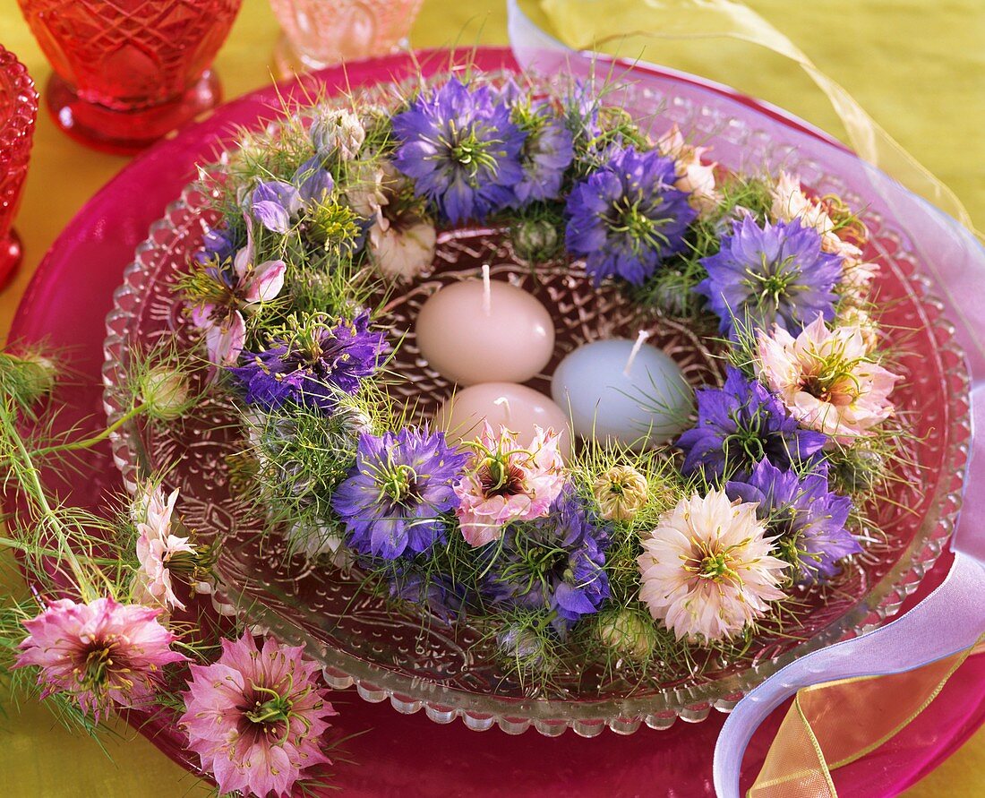 Wreath of Love-in-a-mist with floating candles in a bowl