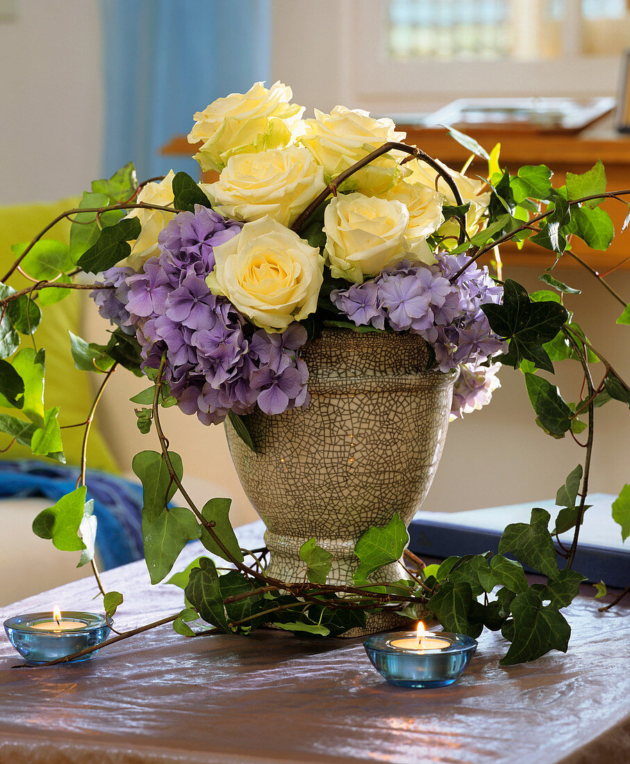 Arrangement of white roses and hydrangeas