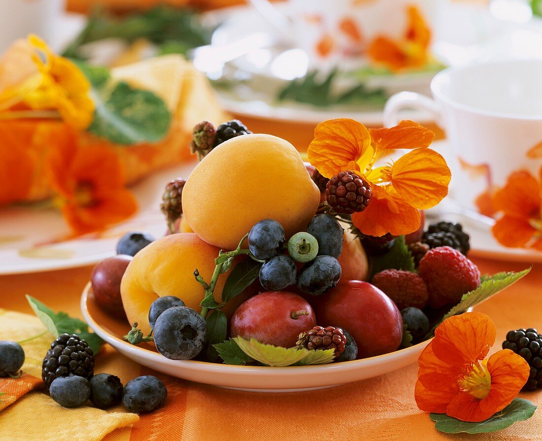 Plate of fruit with nasturtiums