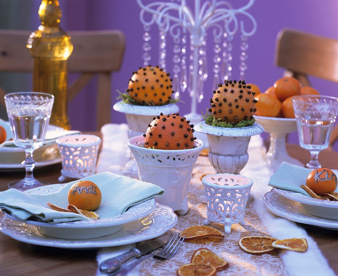Oranges studded with cloves as table decoration