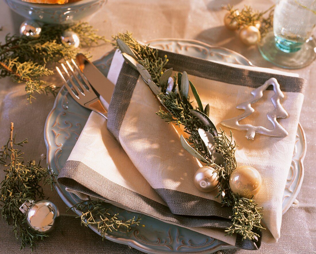 Place-setting with Arizona cypress, olive branch, tree ornament