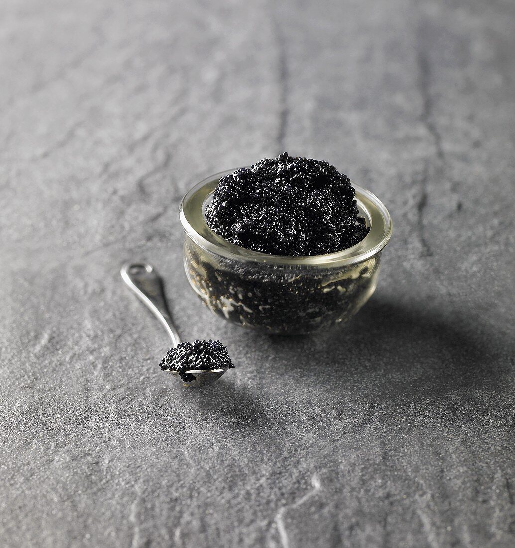 Black caviar in small glass dish
