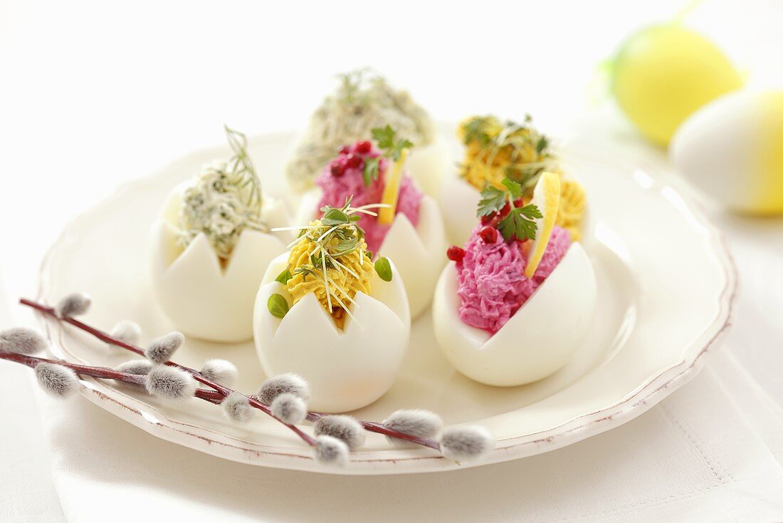 Eggs stuffed with coloured cream cheese for Easter