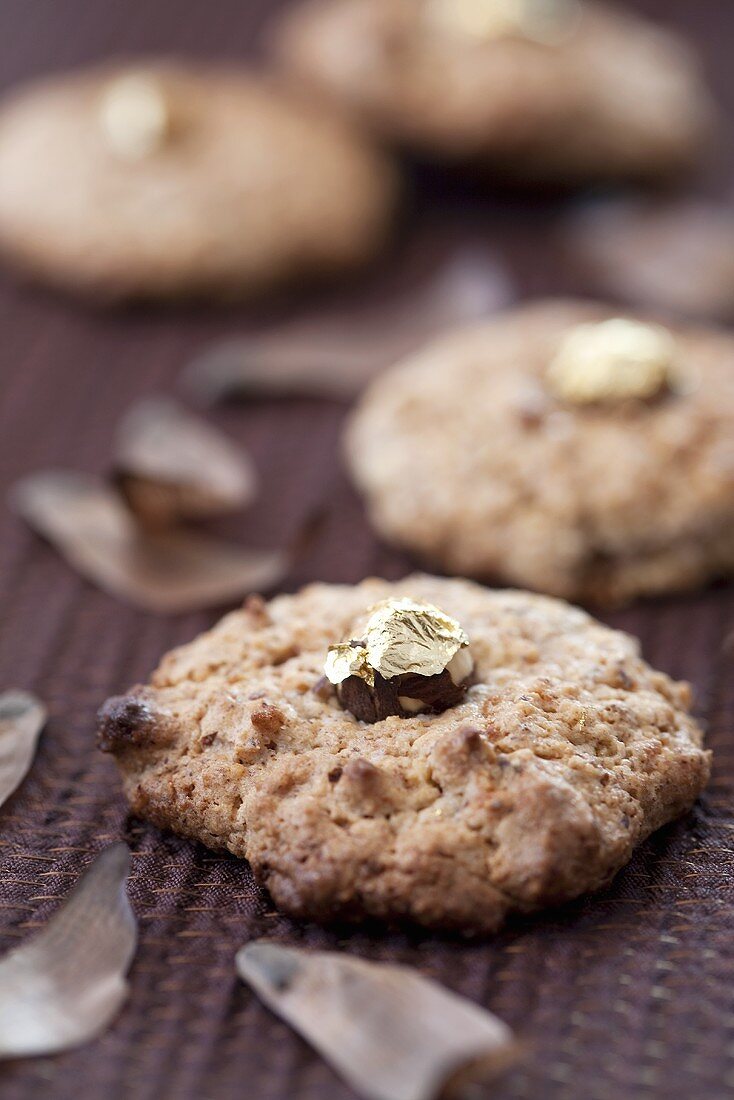 Hazelnut macaroons with gold-coated nuts