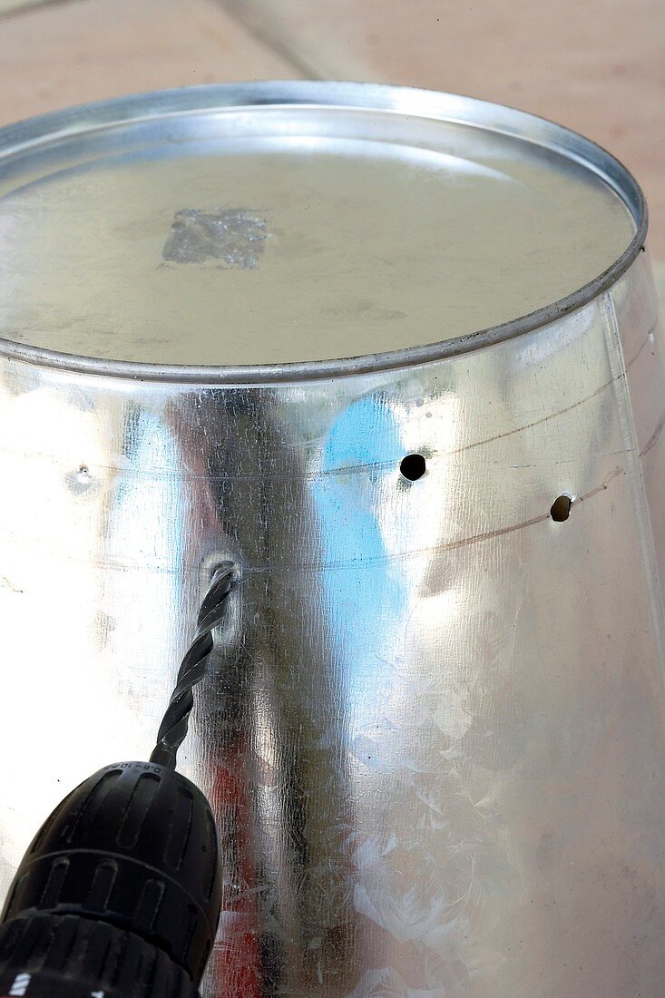 Making a barbecue bucket (drilling holes)