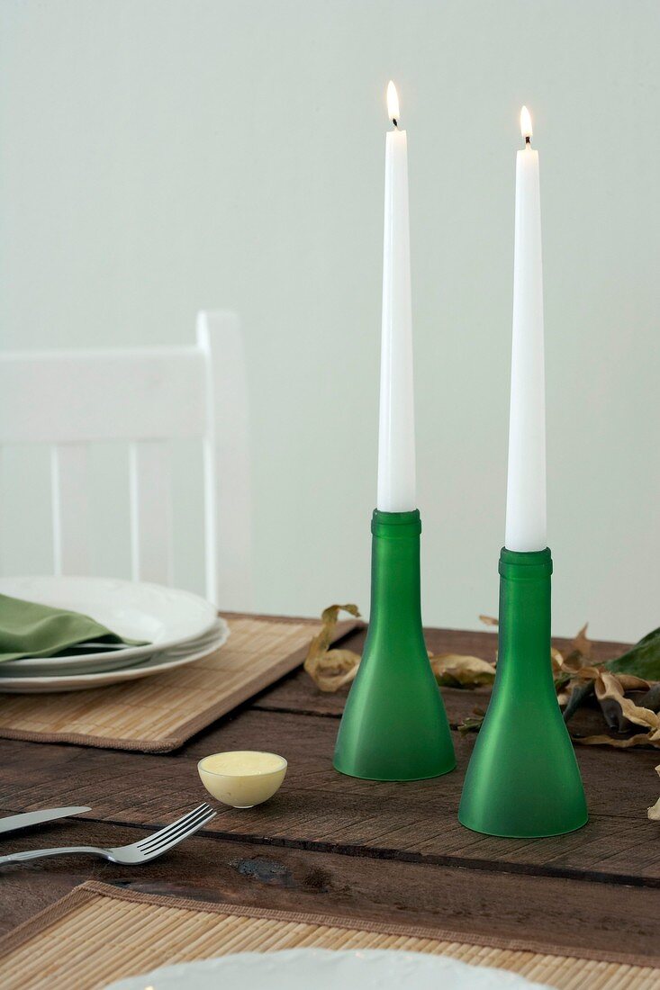 Bottle necks used as candle holders