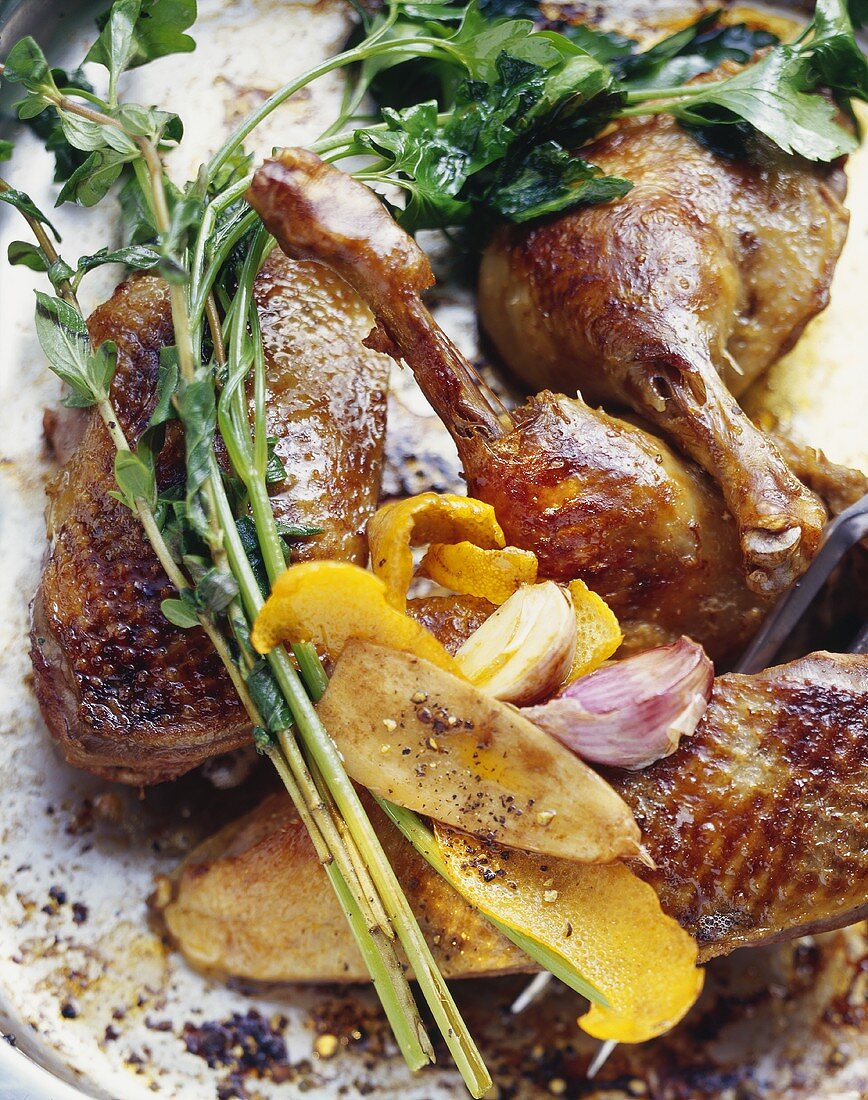 Roast duck with orange peel, garlic and herbs