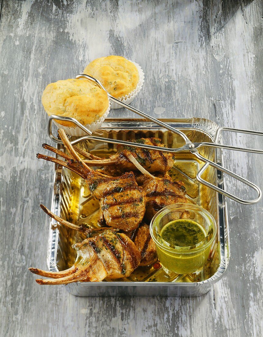 Grilled lamb cutlets with herb sauce and cheese muffins
