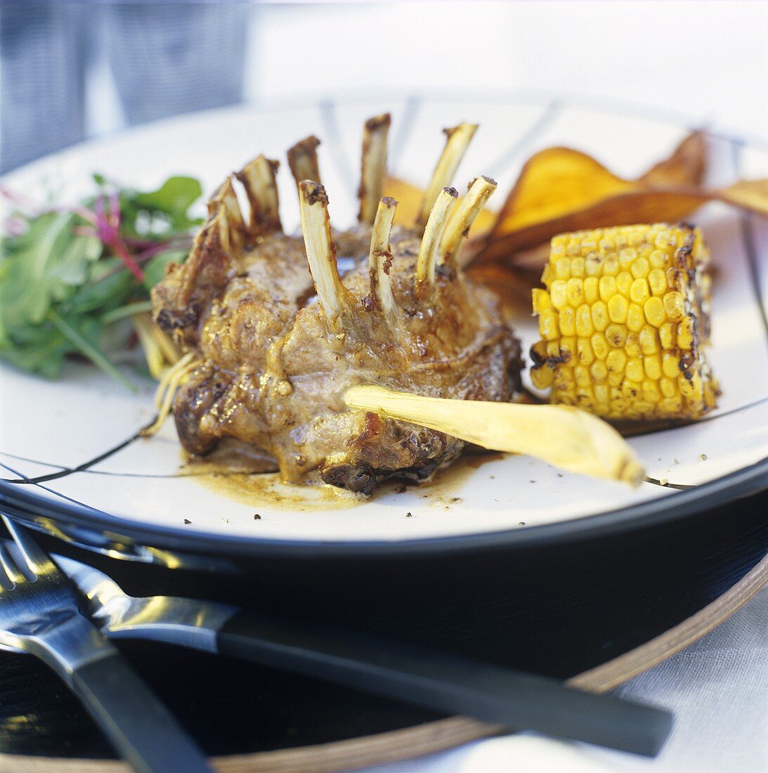 Wild boar chops with corn cobs and sweet potatoes