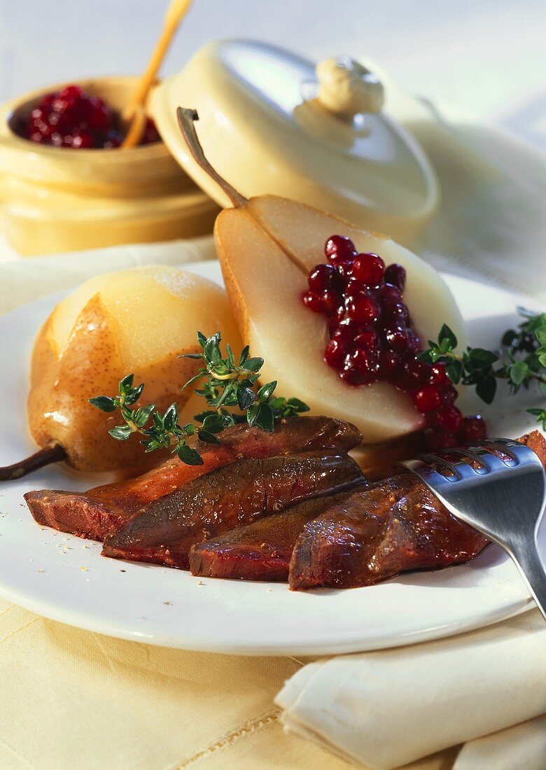 Venison with cranberry-stuffed pear