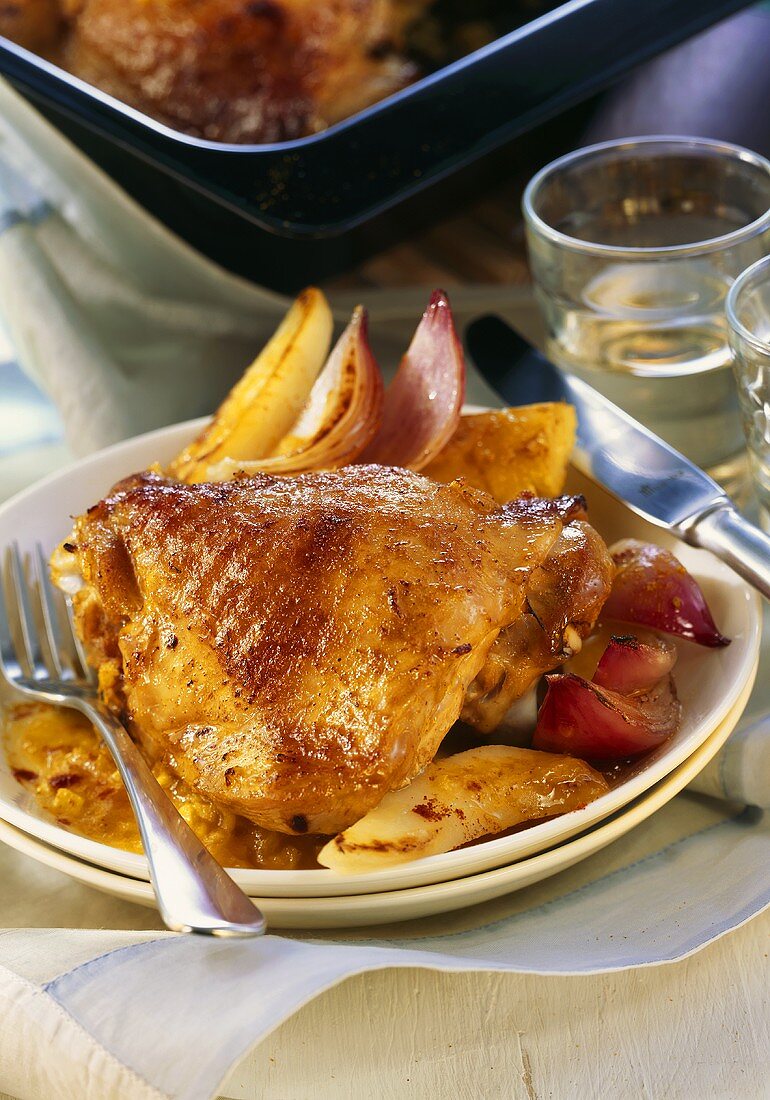 Glazed turkey leg with onions and fruit sauce