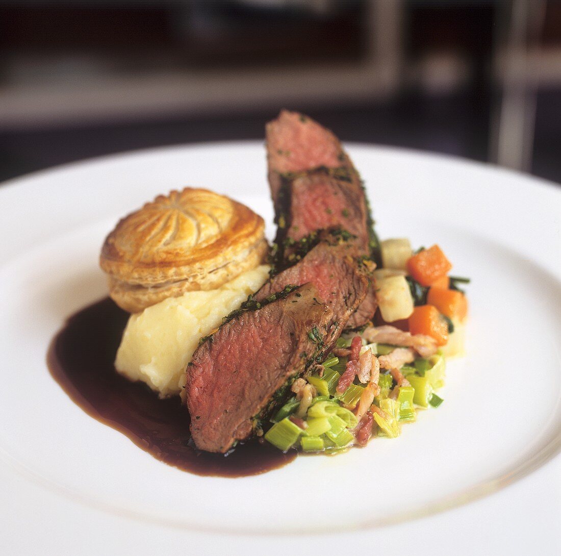 Beef filet with small pie, mashed potato and vegetables