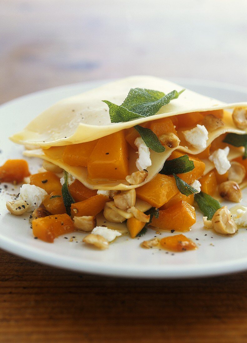 Lasagne with pumpkin, goat's cheese and hazelnuts