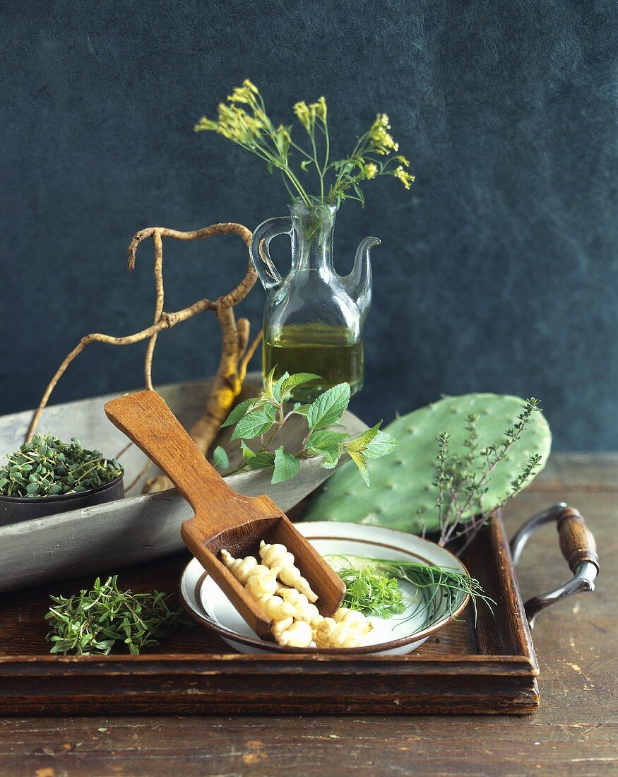 Still life with herbs, rapeseed oil and roots