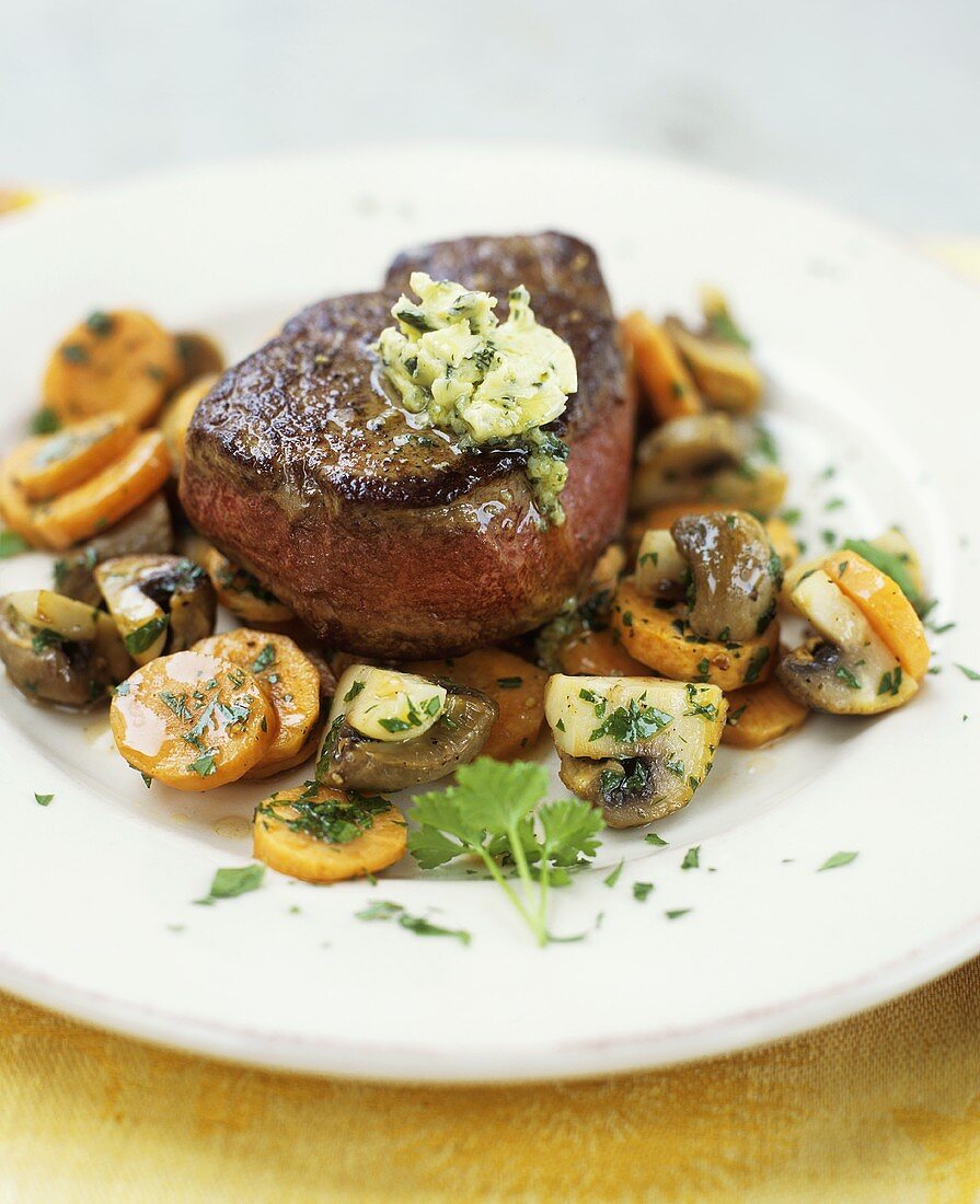 Beef steak with carrots and mushrooms